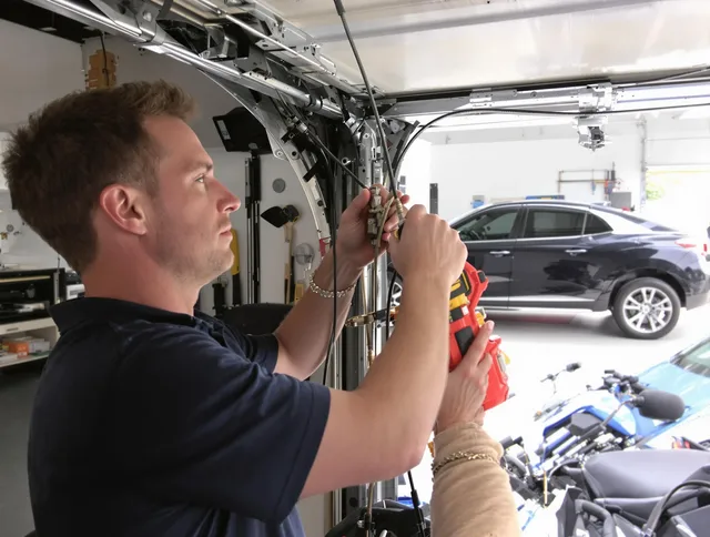 West Palm Beach Garage Door Repair safety certified technician performing cable replacement in West Palm Beach