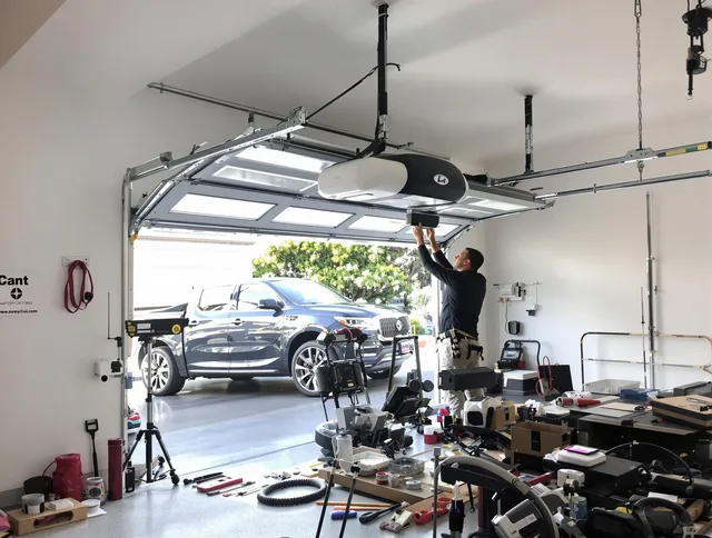 West Palm Beach Garage Door Repair specialist installing smart garage door opener system in West Palm Beach home