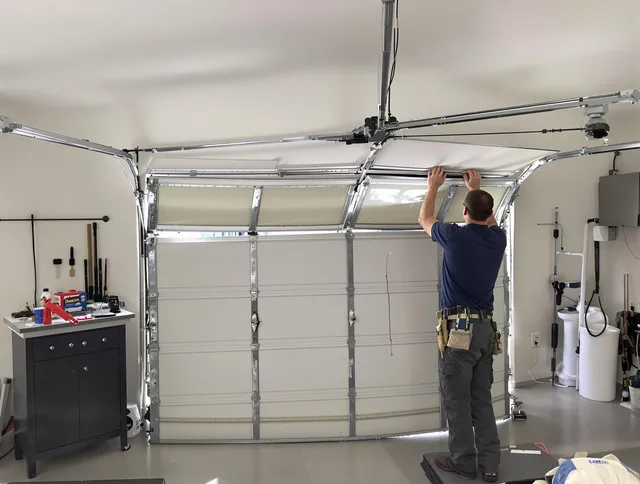 West Palm Beach Garage Door Repair specialist performing precise section replacement on West Palm Beach garage door